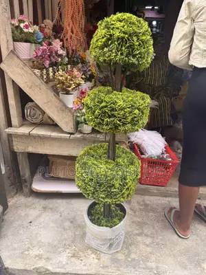 This Artificial Topiary Tree Features Multiple Tiered Green Ball-Shape