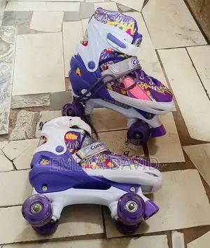 Kids Roller Skates Purple and Graphic Design With Adjustable Sizing.