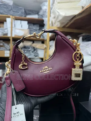 Midi Coach Joine Clutch Bag With a Branded Box