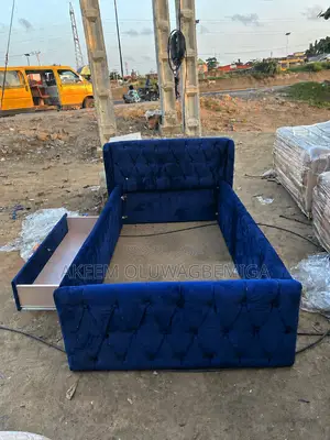 3by6 Button Tufted Blue Bedframe With Drawer by the Side