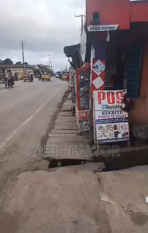 Full Plot of Land With 7 Shop at Adefemi Junction Ipaja Lagos