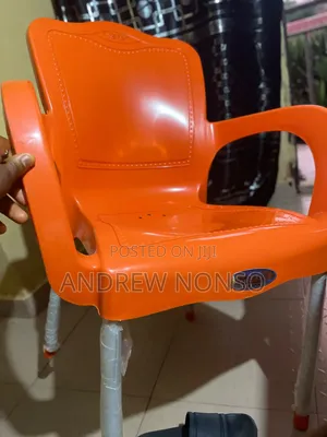Red Plastic Arm Chair With Metal Legs