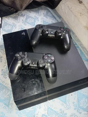 PlayStation 4 Console (1TB Storage) With Two Pads and Loaded Games.