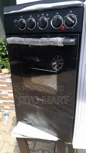 Midea Standing Cooker 3 Gas, 1 Electric 
Dented at the Sides