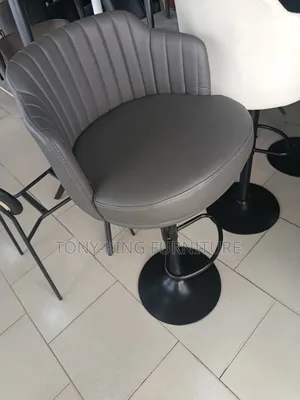 Imported Faux-Leather Bar Stool Features a Modern Swivel Design