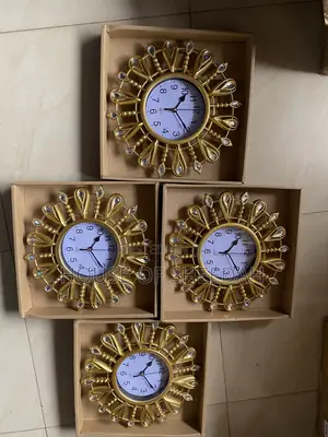 A Decorative Gold Sunburst Clock