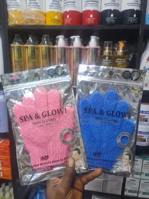 These Beauty Land New York Spa Glow Exfoliating Bath Gloves