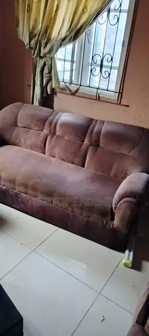 A Bed and Set of Chairs for Sale.