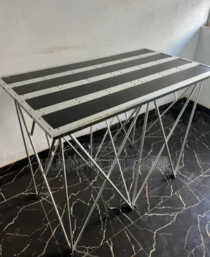 Portable Foldable DJ Stand Commonly Used in Events and DJ Setups.