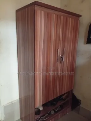 Neatly Used 2-Door Wooden Wardrobe With Shoe Rack – ₦85,000