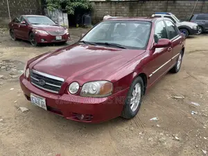 Kia Optima LX Sedan FWD (2.4L 4cyl 5M) 2003 Red