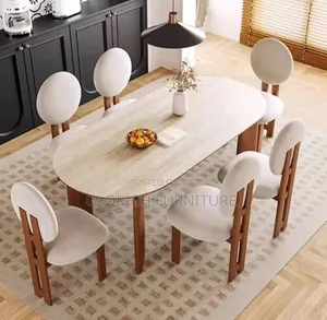 Oval Travertine Dining Table Set –6 Cream Chairs, Sculptural Wood Legs