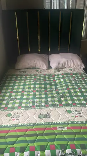 Neatly Used Bed Frame and Mattress.