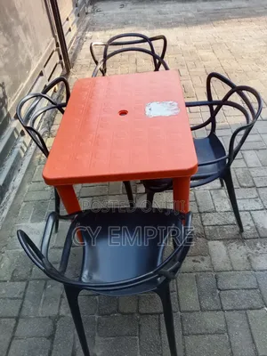 4 Plastic Chairs and 1 Table