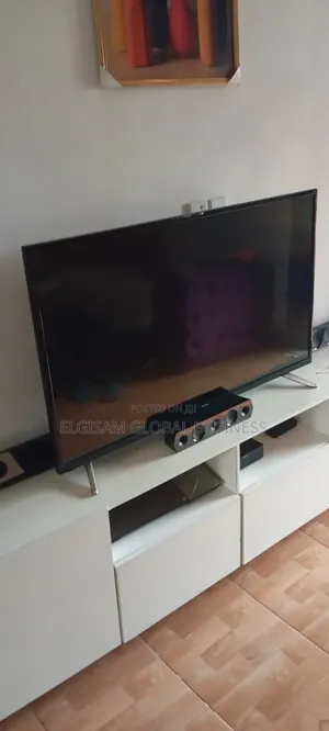 Hisense TV, TV Shelve and Indoor Cycling Bike