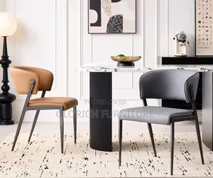 Modern Leather Dining Chair – Curved Backrest, Slim Metal Legs