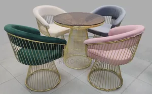 Modern Luxury Armchairs With Curved Backrests and Open-Cage Wire Legs