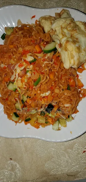 Indomie, Egg, Goat Leg Nkwobi With Periwinkle and Ugba