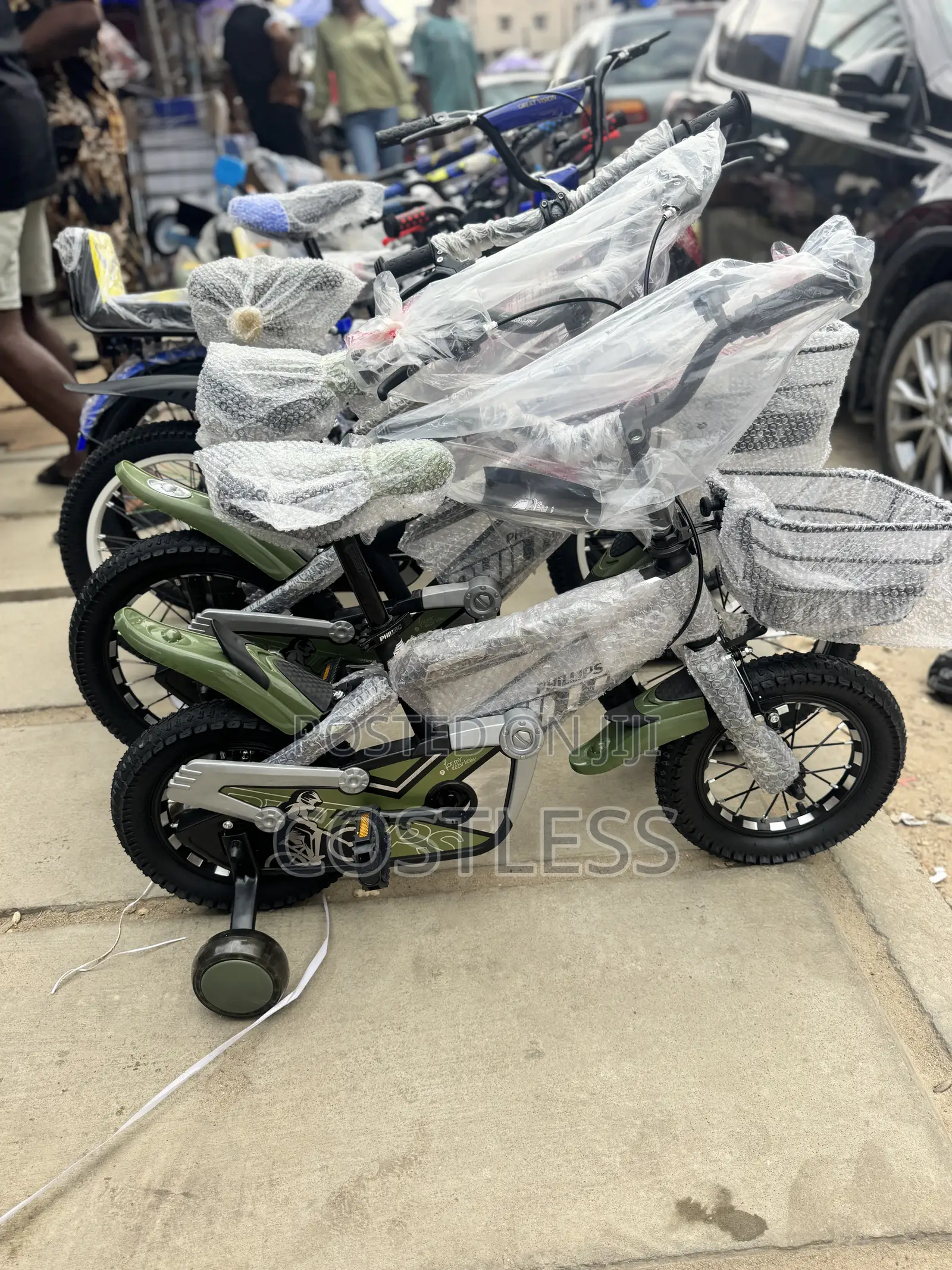 Children's Bicycle Features Training Wheels and a Small Front Basket.