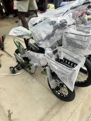 Children's Bicycle Features Training Wheels and a Small Front Basket.