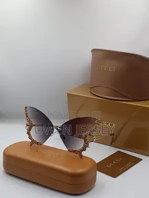 Luxury Gucci Crystal-Embellished Butterfly Sunglasses.