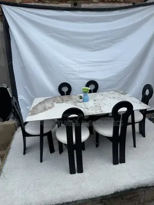 Classy Marble Top Dining  Set by Six Chairs