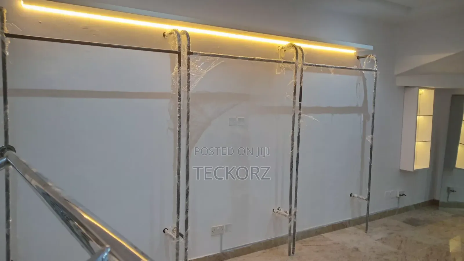 Black Wall Mounted Clothing Rack