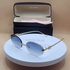 Céline Rimless Oval Sunglasses – Gold-Tone Metal With Blue Lenses