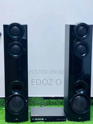LG Home Theater System DVD Player and 2 Tower Speakers