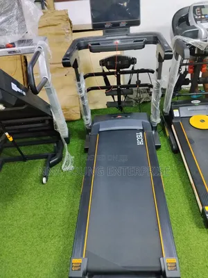 Treadmill Featuring a 4HP Motor and Orange Accents.