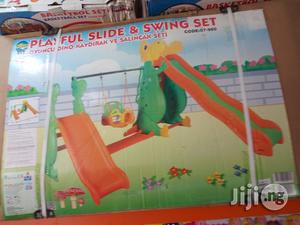 Playful Slide And Swing Set