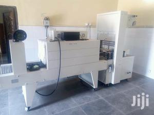 Semi Automatic Shrink Wrapper Packaging Machine.