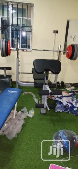 Commercial Olympic Weight Bench and 150kg Barbell