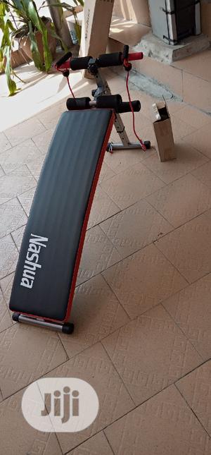 Sit Up Bench With Aerobic Dumbbells and Rope