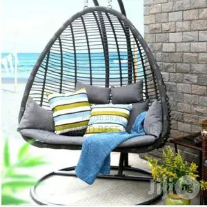 Quality Rattan Made Swing Outdoor and Indoor Chair With Pillows.