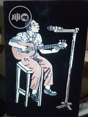 Handmade Artwork Of An African Musician Playing Guitar