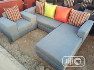 L Shaped Sofa With Multicoloured Pillows