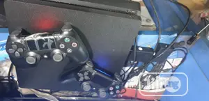 Ps4 Slim Console With 2 Controllers & Fc25 And 10games