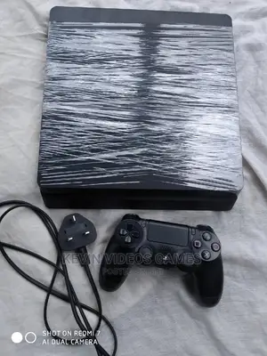 Hacked Ps4 Slim+10 Games(Fifa25,Gta 5,Mk,God of War4 Etc)