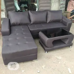 Brown L- Shaped Sofa With Center Table