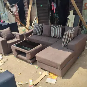 Brown L- Shaped Sofa With One Single and Center Table