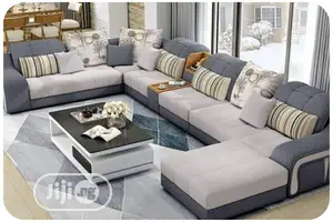 Classic U-Shaped Sofa With Throw Pillows and Center Table