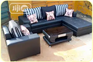 L-Shaped Leather Sofa With a Single and Center Table