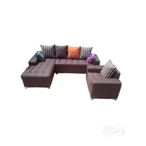 L Shaped Brown Fabric Sofa With Pillows