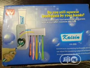 Toothpaste Dispenser and Brush Holder