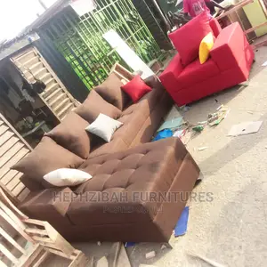 L Shaped Sofa With Multicolored Pillows