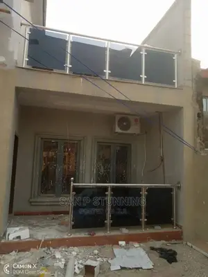 Stainless Handrail Construction With Dark Gray Glass