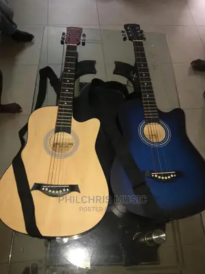 BRAND NEW ACOUSTIC GUITAR(With Bag, Capo a Set of String)