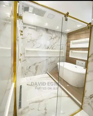 Shower Cubicle With Golden Accessories