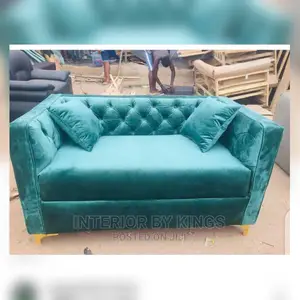 2seater Fabric Sofa Tufted to Perfection.With Plated Legs